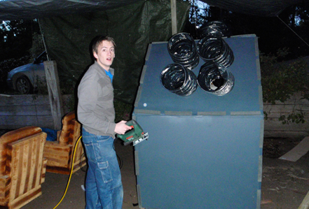 Chris Building the Spaceship Chris attacks the spaceship with a jigsaw.
