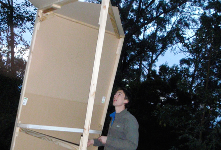 Chris is building away. Chris (with very little building experience) struggles to make the structure hold together.